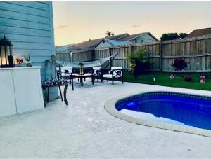 view of pool featuring a patio area and fence