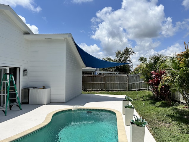 view of pool featuring a patio area, fence, and a fenced in pool