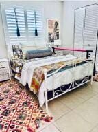 bedroom featuring tile patterned flooring