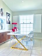 interior space featuring tile patterned flooring and baseboards