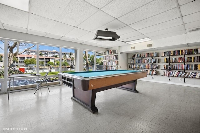 recreation room featuring visible vents, a paneled ceiling, and tile patterned floors