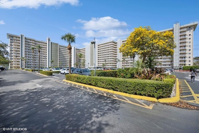 view of property with uncovered parking