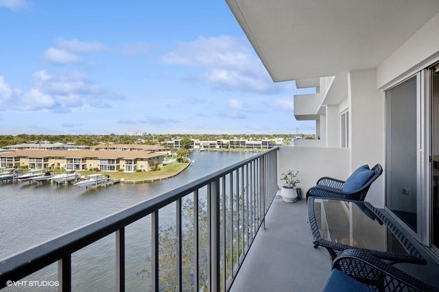 balcony featuring a water view