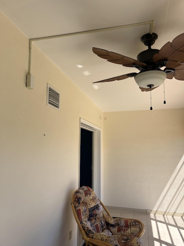 interior space featuring a ceiling fan and visible vents