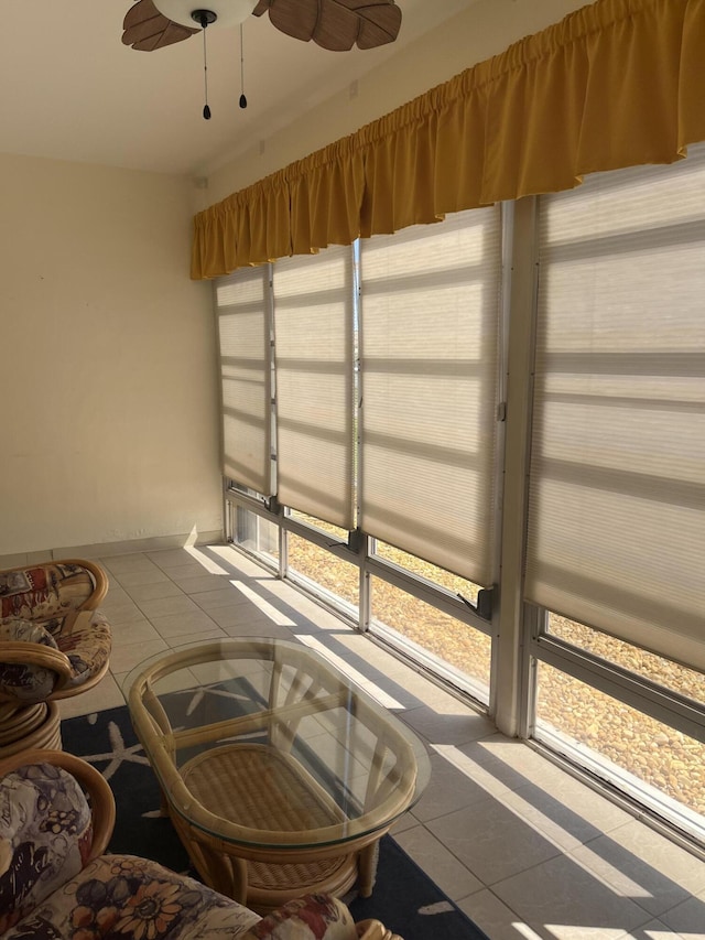 sunroom with a ceiling fan and a healthy amount of sunlight