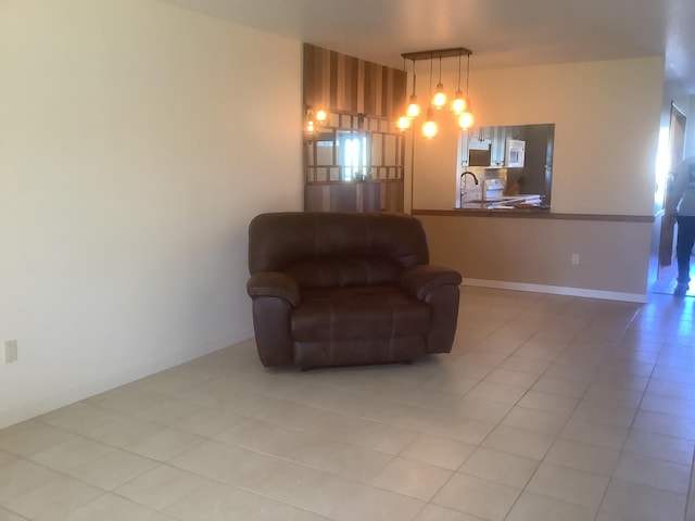 living area featuring baseboards