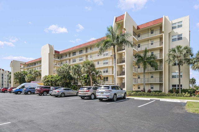 view of property featuring uncovered parking