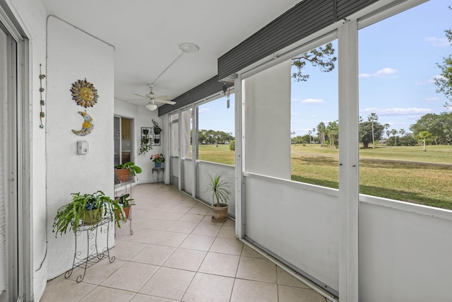 sunroom / solarium with ceiling fan