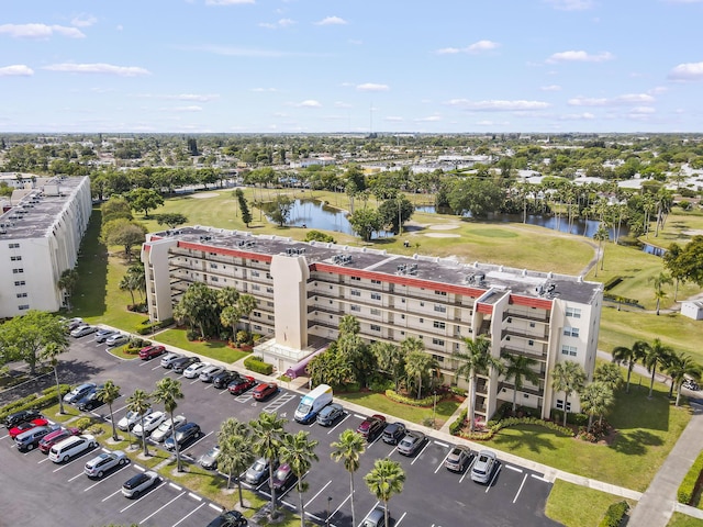 aerial view featuring a water view and golf course view