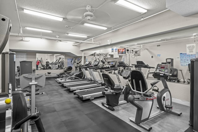 gym with a textured ceiling