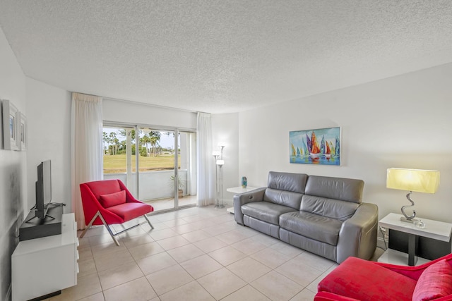 living area with light tile patterned floors and a textured ceiling