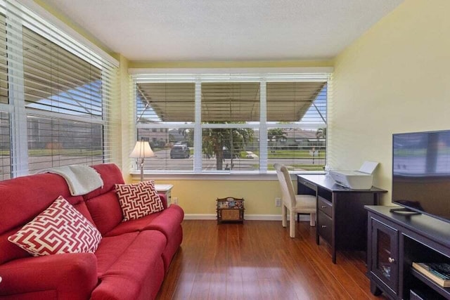 interior space featuring wood finished floors and baseboards