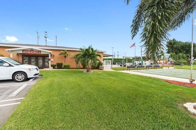 view of property with uncovered parking