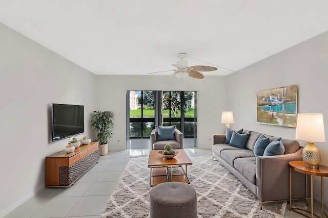 living area featuring a ceiling fan and light tile patterned floors