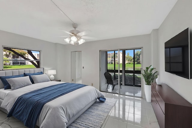 bedroom featuring access to exterior, multiple windows, and ceiling fan