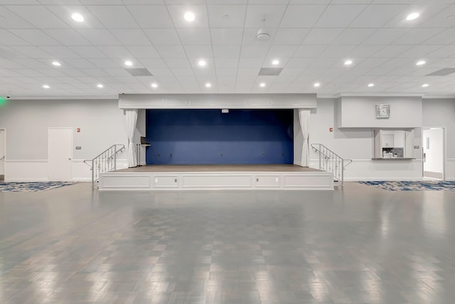 unfurnished living room featuring stairway, recessed lighting, wood finished floors, and baseboards