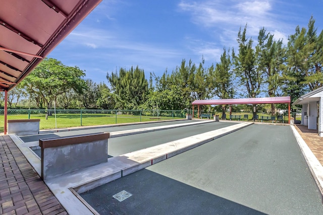 view of home's community featuring a yard and fence