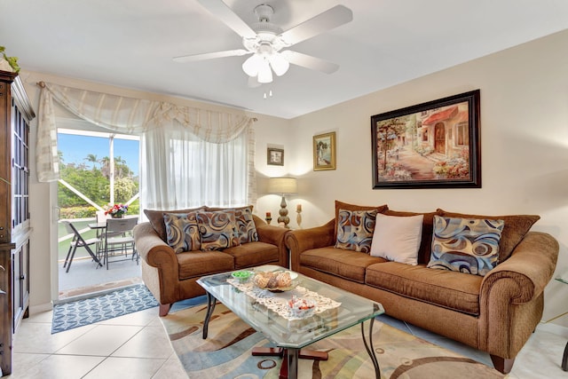 living area with light tile patterned floors and ceiling fan