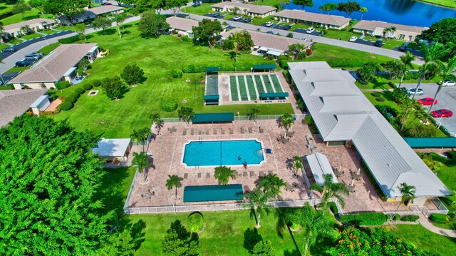 birds eye view of property with a water view and a residential view