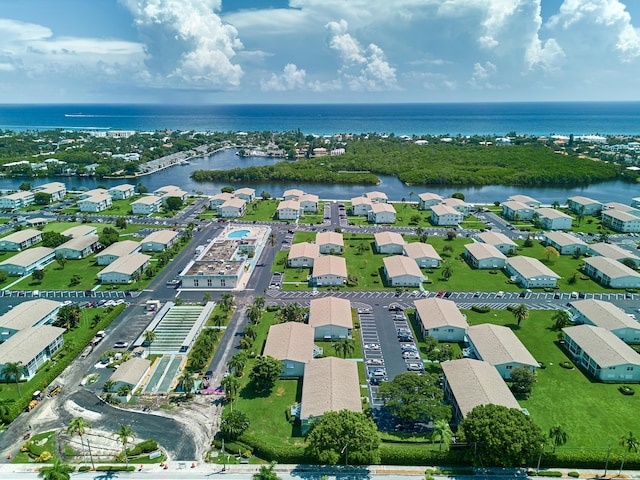 birds eye view of property featuring a water view and a residential view