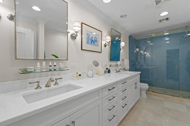 full bathroom with a sink, double vanity, a stall shower, and crown molding