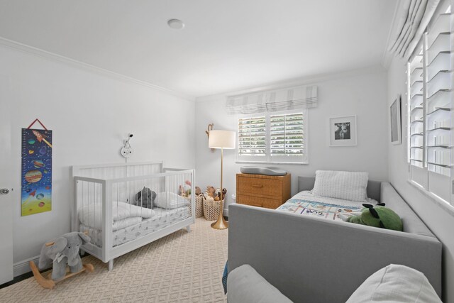 carpeted bedroom with multiple windows and ornamental molding