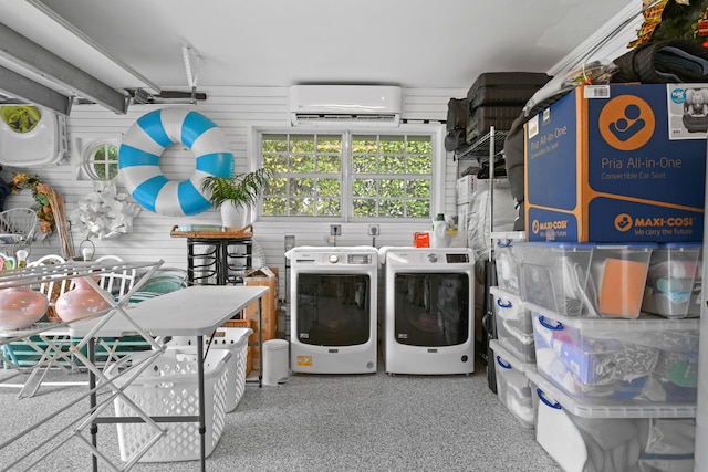 laundry area with washing machine and clothes dryer, laundry area, and a wall mounted AC