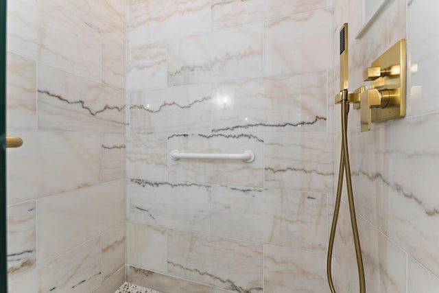 full bathroom with tiled shower