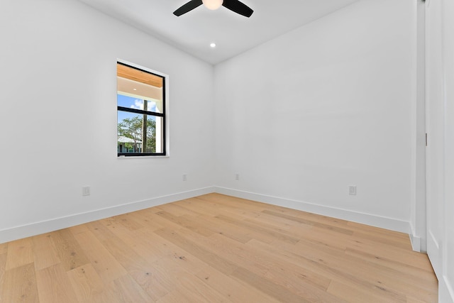 spare room with a ceiling fan, recessed lighting, light wood-style flooring, and baseboards