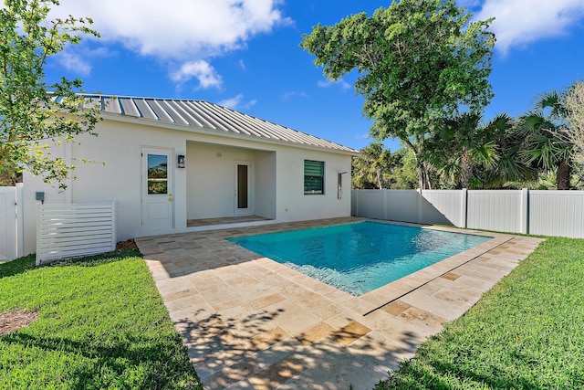 view of pool featuring a fenced in pool, a patio area, a fenced backyard, and a lawn