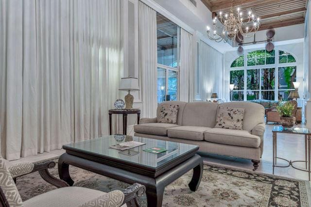 interior space with a notable chandelier and a towering ceiling