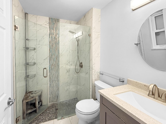 full bath featuring vanity, toilet, marble finish floor, and a marble finish shower