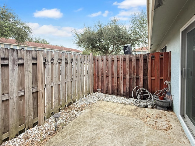 view of yard with a patio area and a fenced backyard