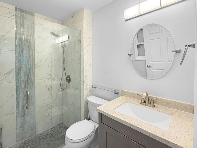 full bathroom featuring vanity, toilet, and a marble finish shower