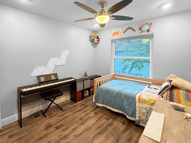 bedroom featuring a ceiling fan, recessed lighting, wood finished floors, and baseboards