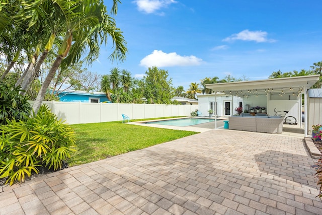 view of swimming pool with a patio, a fenced backyard, an outdoor living space, a yard, and a fenced in pool