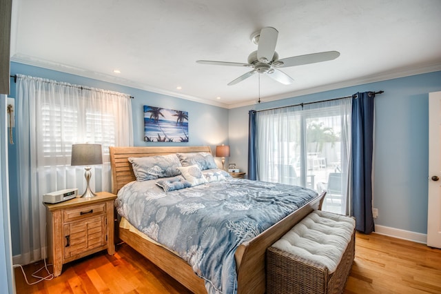 bedroom with multiple windows, light wood-type flooring, and crown molding