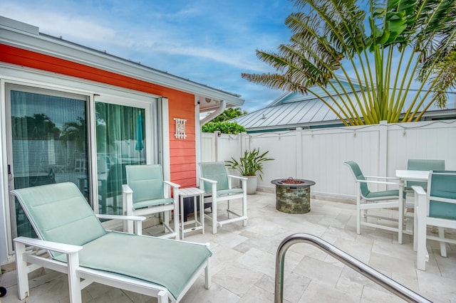 view of patio featuring fence