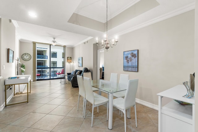 dining area featuring light tile patterned floors, a raised ceiling, and crown molding