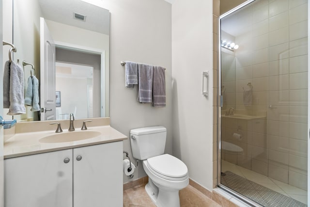 full bath with visible vents, toilet, tile patterned flooring, vanity, and a shower stall