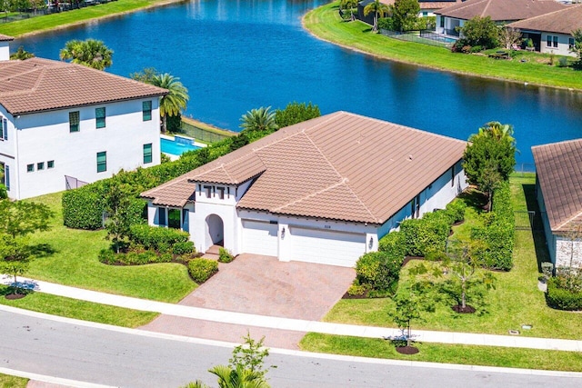 birds eye view of property with a residential view and a water view