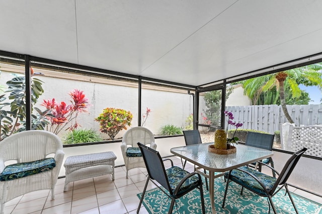 view of patio featuring outdoor dining space and fence