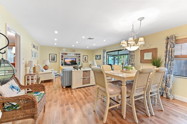 998 NW 26th Ave, Delray Beach, FL 33445 - dining space with a chandelier, light wood-type flooring, recessed lighting, and baseboards