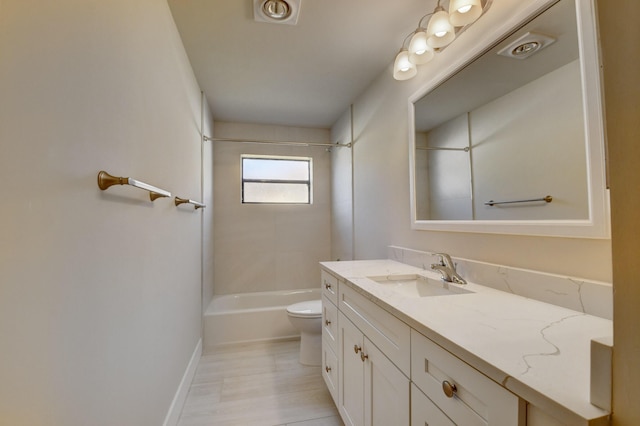 bathroom with baseboards, shower / tub combination, vanity, and toilet