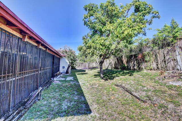 view of yard with a fenced backyard