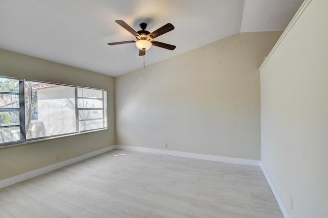 empty room with a ceiling fan and baseboards