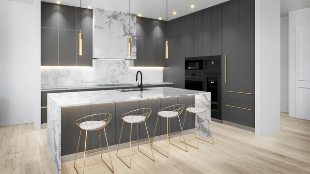 kitchen featuring light wood finished floors, modern cabinets, and backsplash