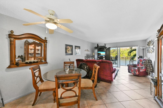 dining room featuring light tile patterned floors and ceiling fan