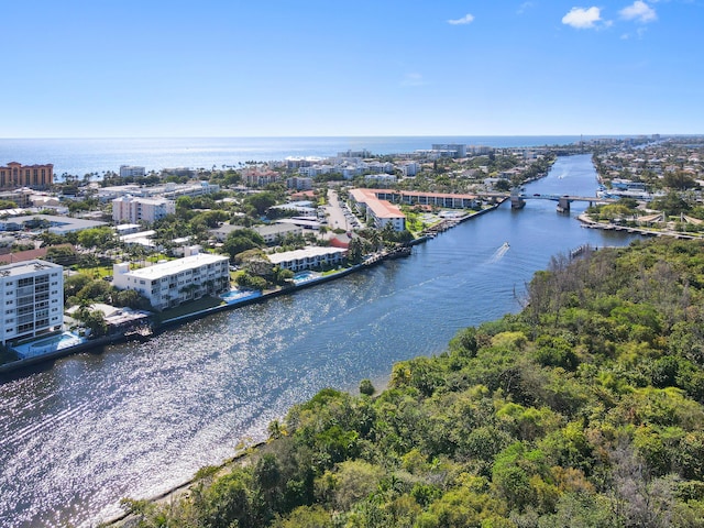 bird's eye view featuring a water view and a city view