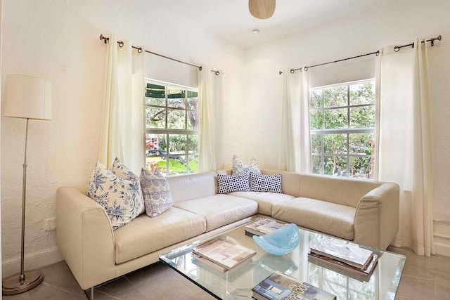 tiled living room with plenty of natural light